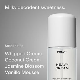 PHLUR three 3 fl oz mists in hand to show travel-friendly size and portability
