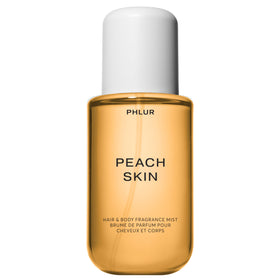 PHLUR front bottle showing Peach Skin label and elegant packaging benefit: clear product identity