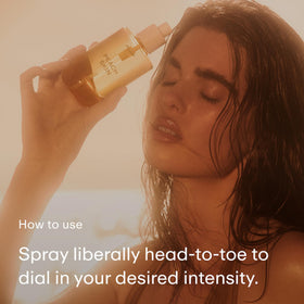 PHLUR mist on forearm texture shot showing subtle finish benefit: light non-greasy feel