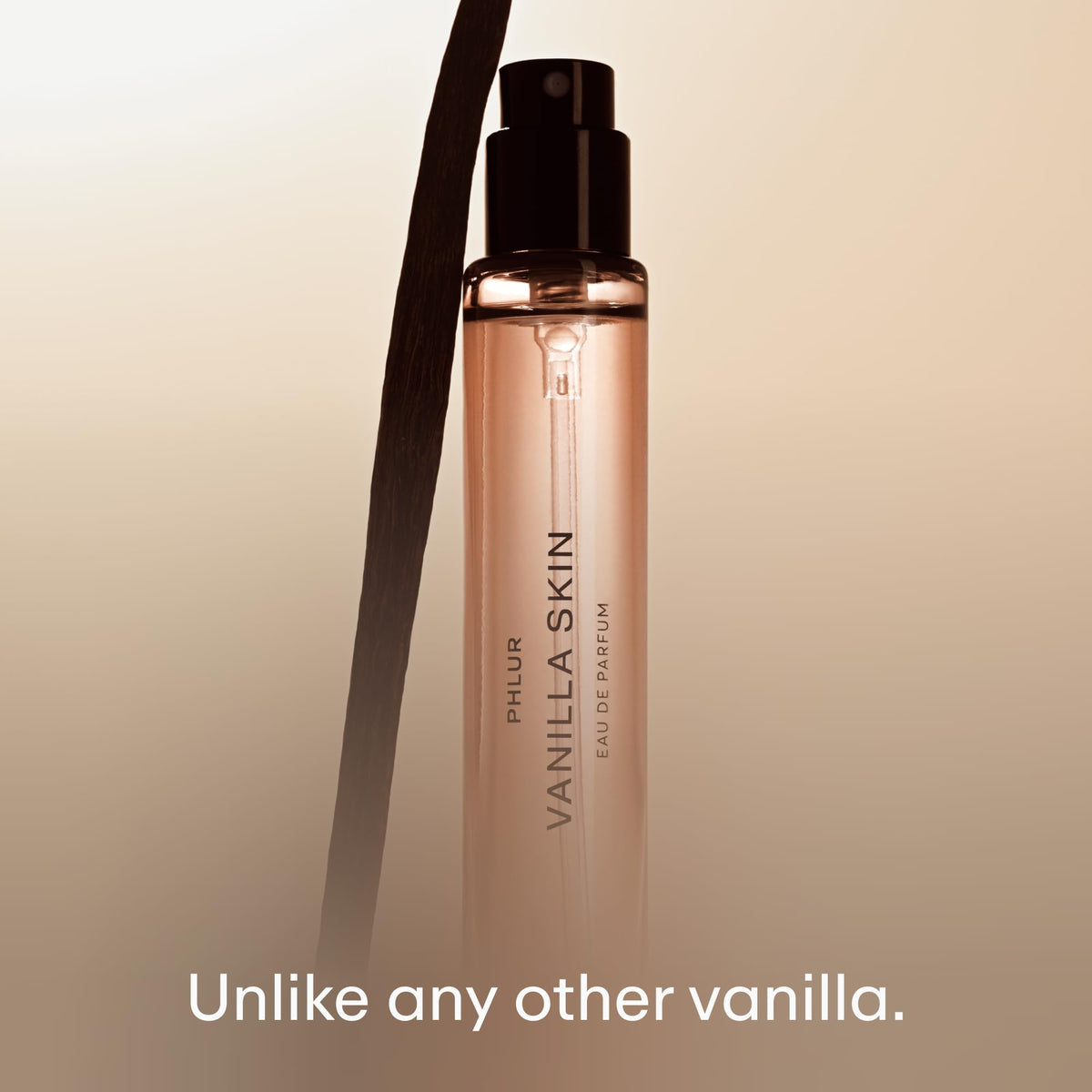PHLUR bottle in hand to show 9.5 mL size and easy portability benefit
