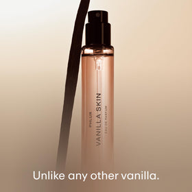 PHLUR bottle in hand to show 9.5 mL size and easy portability benefit