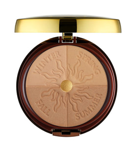 Physicians Formula bronzer next to credit card for scale to show compact, travel-friendly size