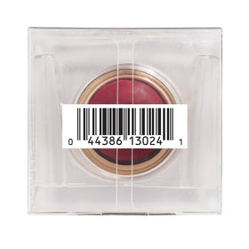 Physicians Formula stick beside coin for scale showing compact travel-ready size and convenience