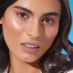 Physicians Formula palette applied on model showing natural bronzed glow benefit