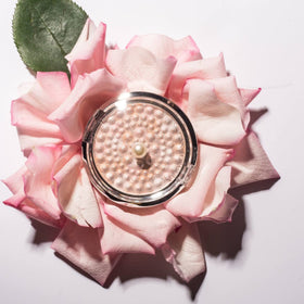 Physicians Formula compact inside makeup bag lifestyle image showing portability and quick touchups