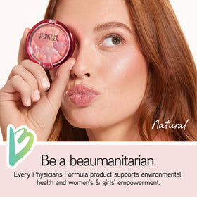 Physicians Formula applied on model cheeks demonstrating natural glow and mood-lifting scent
