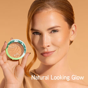 Physicians Formula bronzer held in hand to show size and travel-friendly benefit