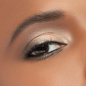 Physicians Formula palette in use with brush applying shimmer for focused, buildable color