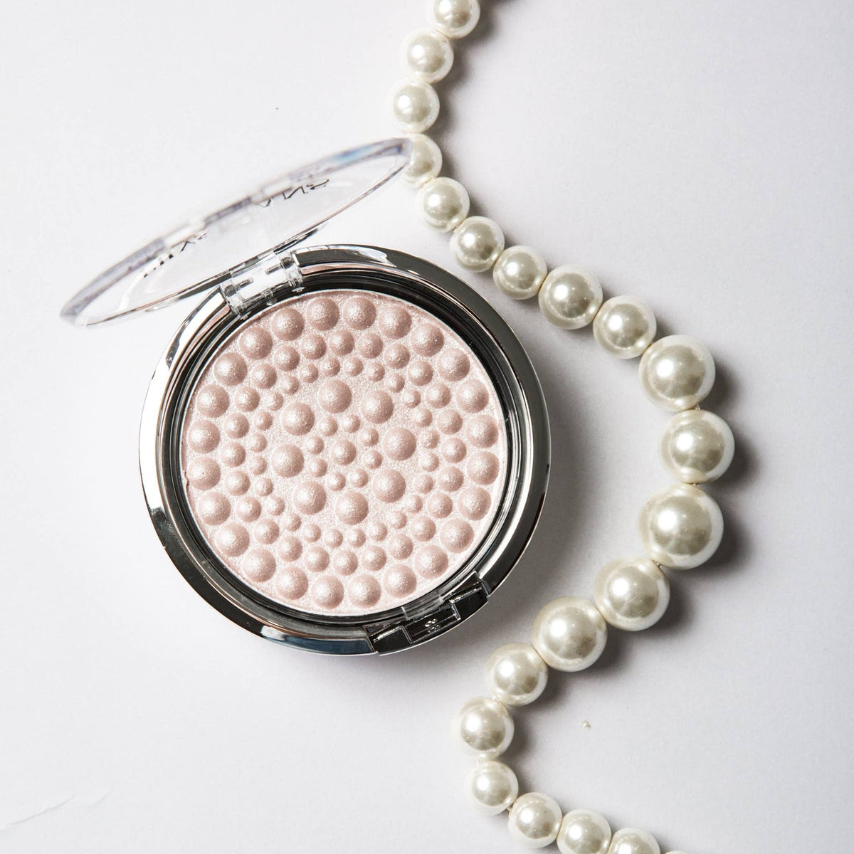 Physicians Formula swatch on skin showing even luminous finish and natural-looking glow