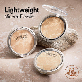 Physicians Formula open compact with sponge demonstrating convenient travel-ready application