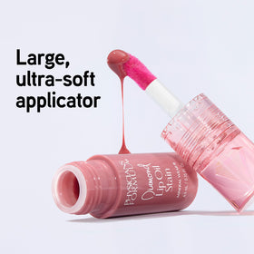 Physicians Formula radiant rose beside coin for size comparison and portability