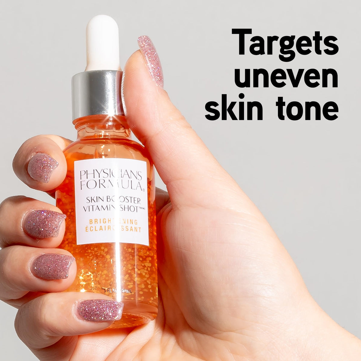 Physicians Formula serum on back of hand illustrating lightweight, fast-absorbing texture