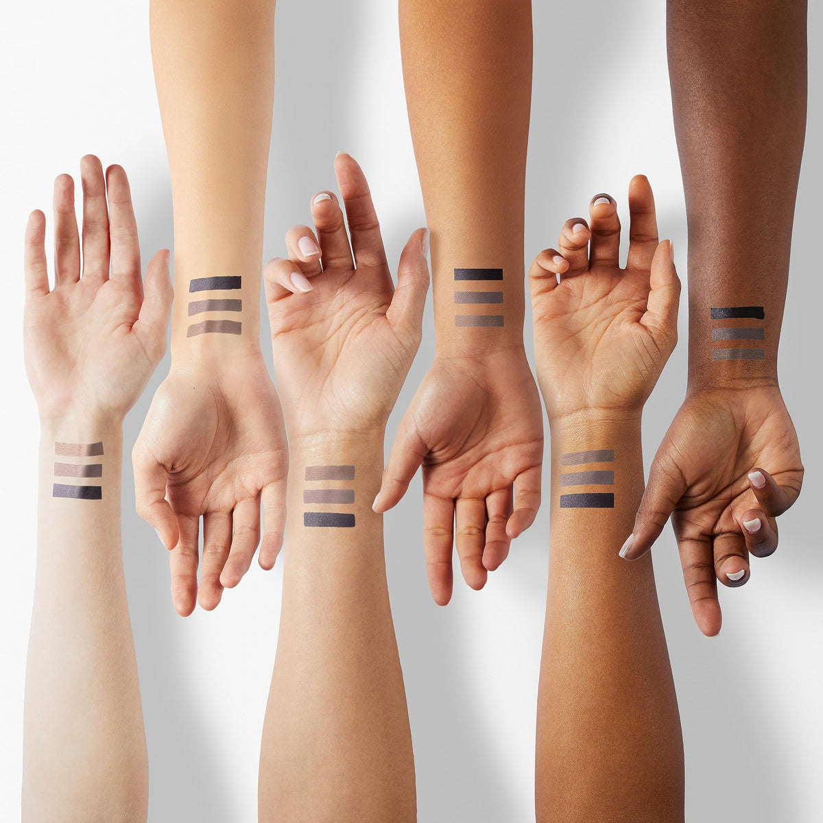 Physicians Formula swatches on skin highlighting pigment payoff and light-reflecting shimmer