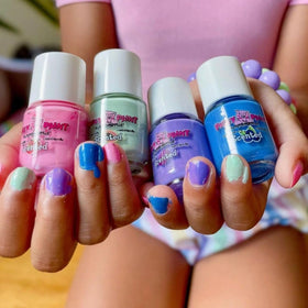 Piggy Paint bottles arranged flatlay showing four scented shades for mixing and gifting