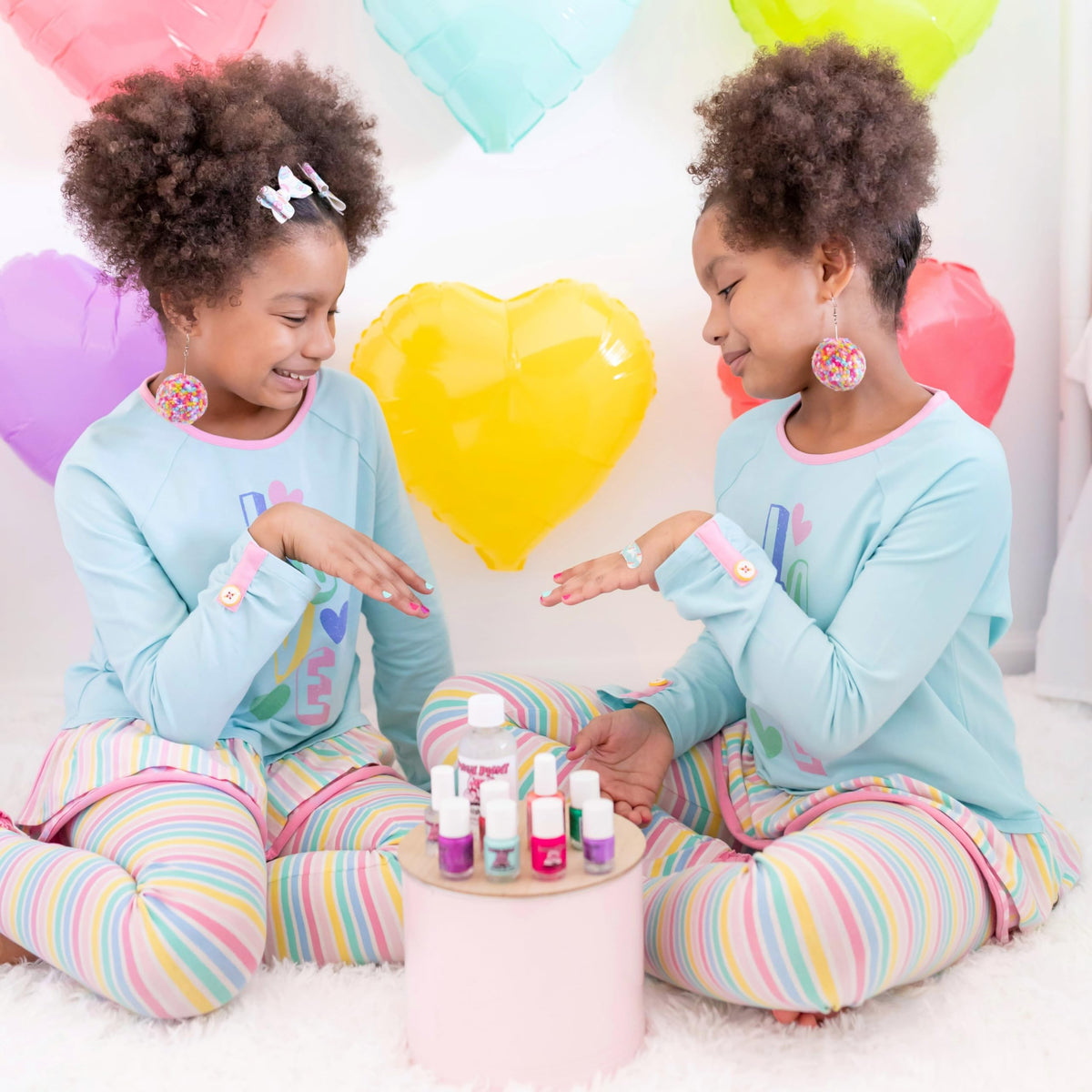 Piggy Paint family doing manicures together showing bonding activity