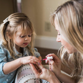 Piggy Paint glossy finish on a child nail showing durable, chip-resistant look