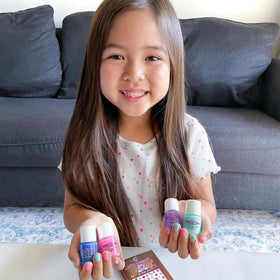 Piggy Paint bottle beside a coin size comparison highlighting compact travel-friendly bottles