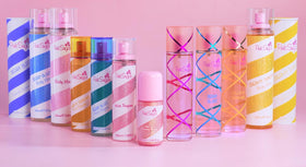 Pink Sugar bottle in hand to show 3.38 fl oz travel-friendly size