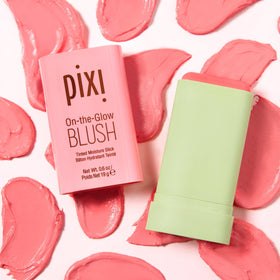 Pixi applying blush stick to cheeks for a natural dewy finish