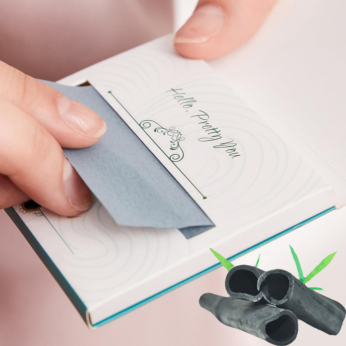 PleasingCare dispenser open with one sheet pulled out for sanitary single use
