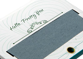 Hand holding a PleasingCare blotting sheet demonstrating easy oil removal and makeup protection
