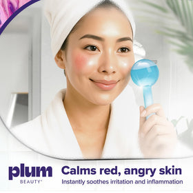 Plum Beauty globe held in hand showing scale and ergonomic grip for controlled massage