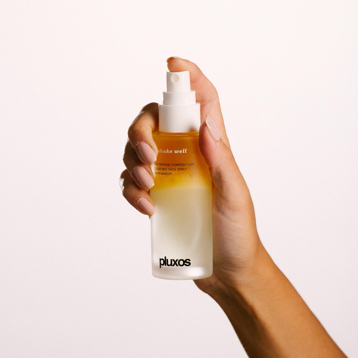 PLUXOS mist close-up spray demonstrating fine particle coverage for even protection