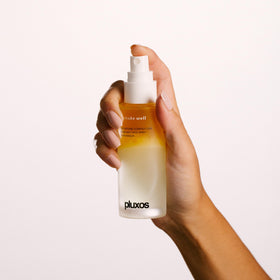 PLUXOS mist close-up spray demonstrating fine particle coverage for even protection