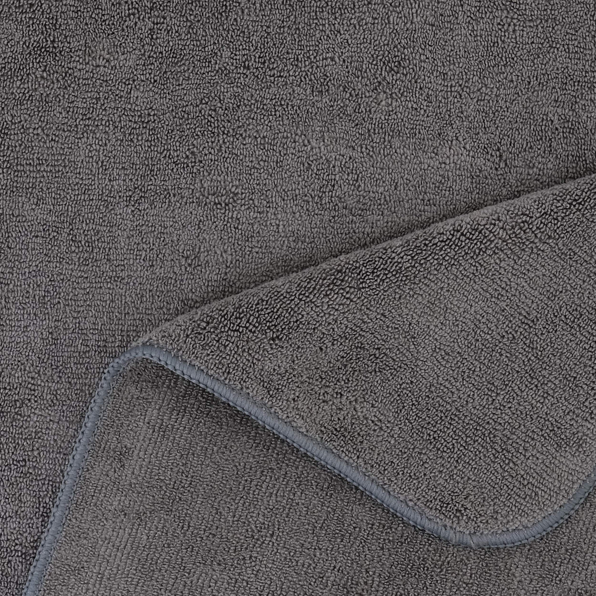 POLYTE towel beside ruler showing 20 x 40 inch size for full hair coverage