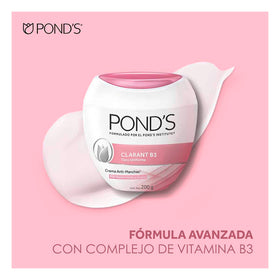 Person applying POND'S cream to cheek for even tone benefit