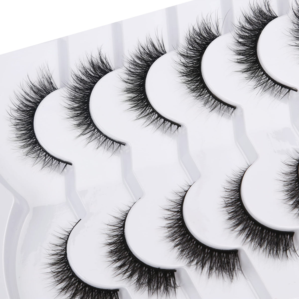 Pooplunch lash pair in hand demonstrating size and scale