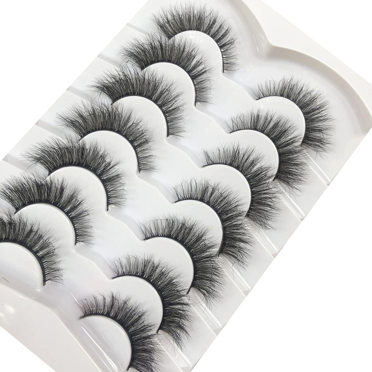 Pooplunch lashes on vanity with glue and tools showing everyday styling benefit