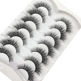 Pooplunch lashes on vanity with glue and tools showing everyday styling benefit