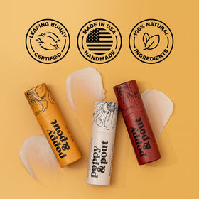 Poppy & Pout tube in hand showing jumbo size and travel-friendly benefit