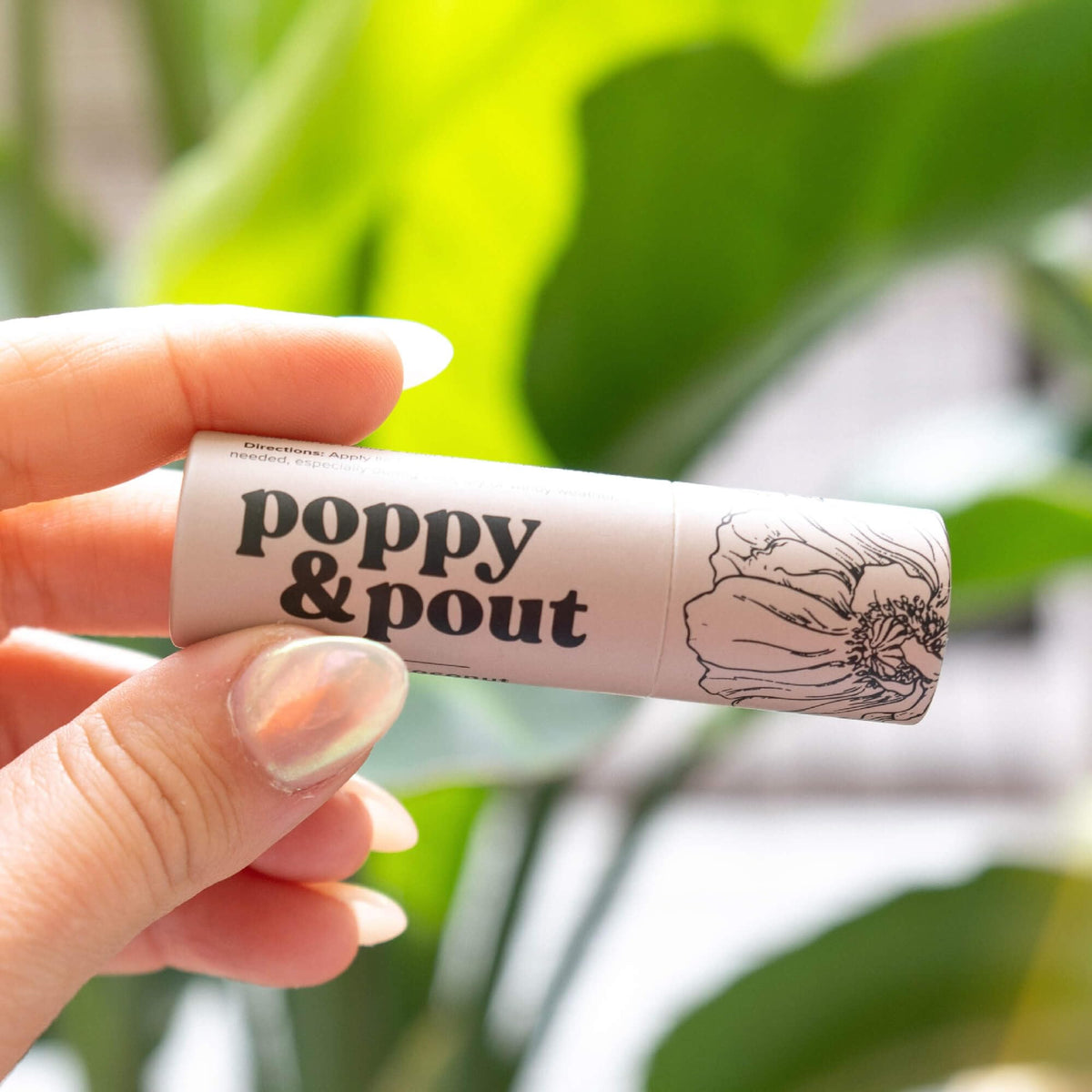 Poppy & Pout in hand for size comparison showing jumbo capacity convenience