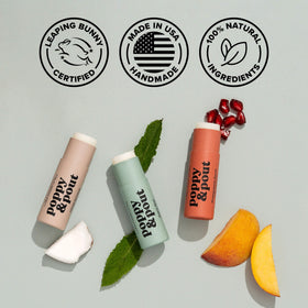 Poppy & Pout model applying balm showing subtle mint sheen and hydration