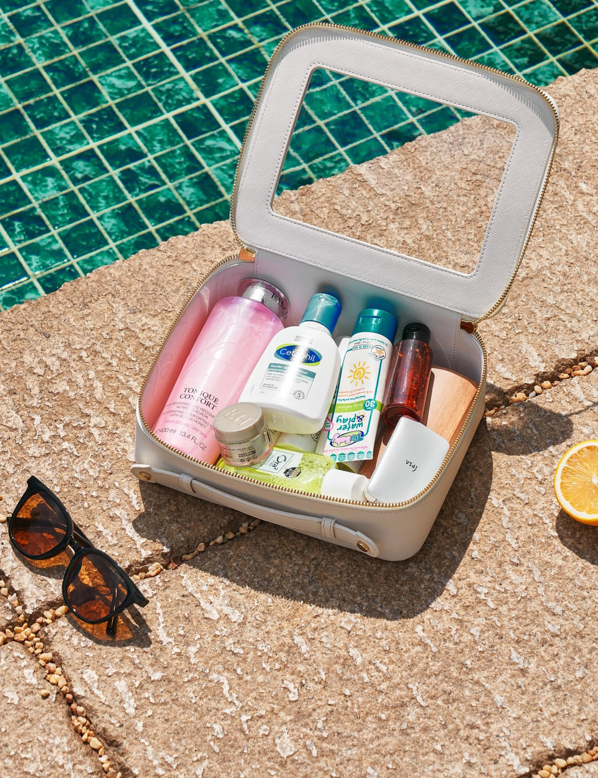 Popvibe size comparison with travel toiletries to show roomy capacity