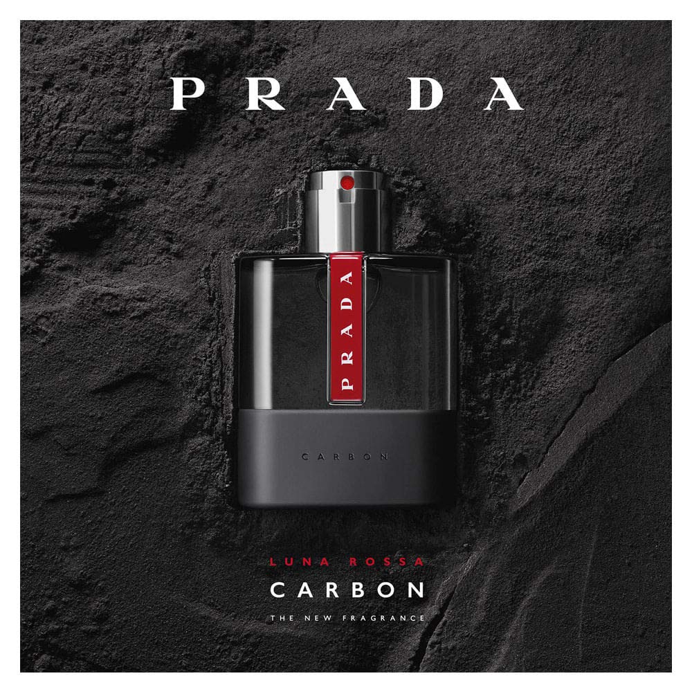 Prada Luna Rossa Carbon held in hand to show 3.4 oz scale and travel-friendly convenience