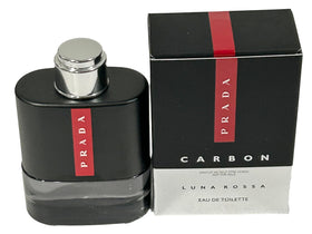 Prada Luna Rossa Carbon mini held in hand demonstrating small size for travel