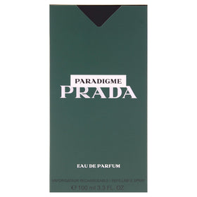 Prada Paradigme bottle in hand to show 3.3 oz scale and everyday carry convenience
