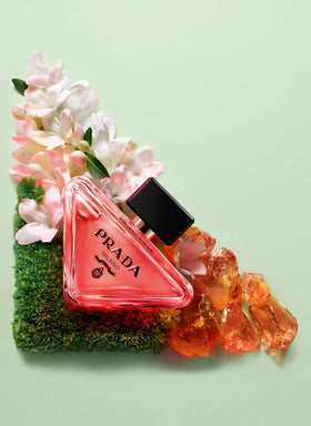 Prada Paradoxe Intense bottle in hand indicating 3.0 oz scale and easy portability