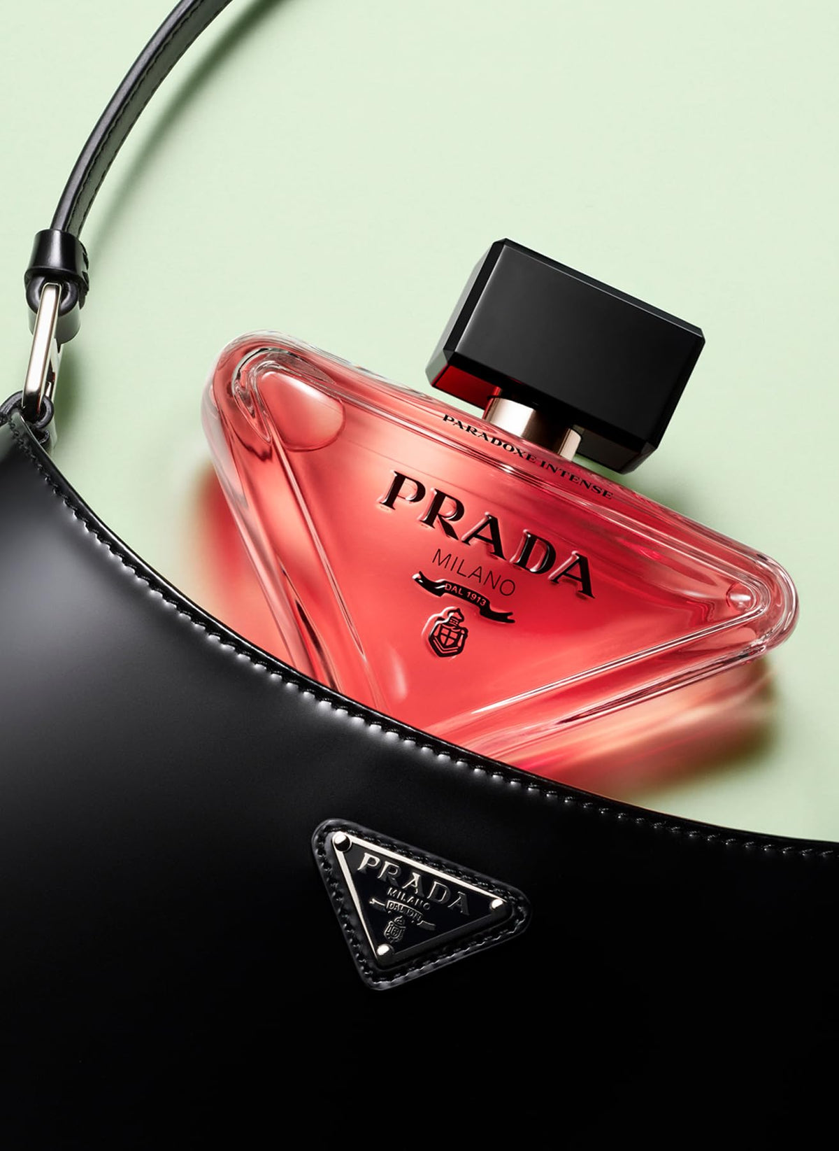 Prada Paradoxe Intense lifestyle on dresser suggesting evening wear and refined presence