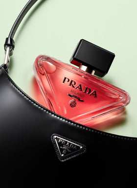 Prada Paradoxe Intense lifestyle on dresser suggesting evening wear and refined presence