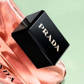 Prada Paradoxe lifestyle vanity scene with bottle near mirror suggesting everyday luxury