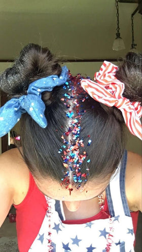 Prehot blue glitter used as hairline highlight adding bold festival-ready color