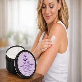 Premium Hemp Extract Daily being massaged into shoulder for targeted relief and hydration