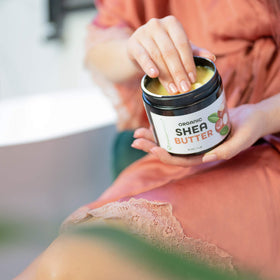 Premium Nature shea butter being rubbed into hands to soothe and soften skin