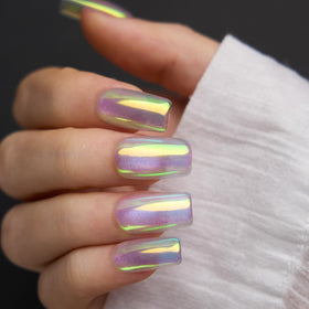 Pretty Diva finished manicure in lifestyle setting shows mermaid iridescence