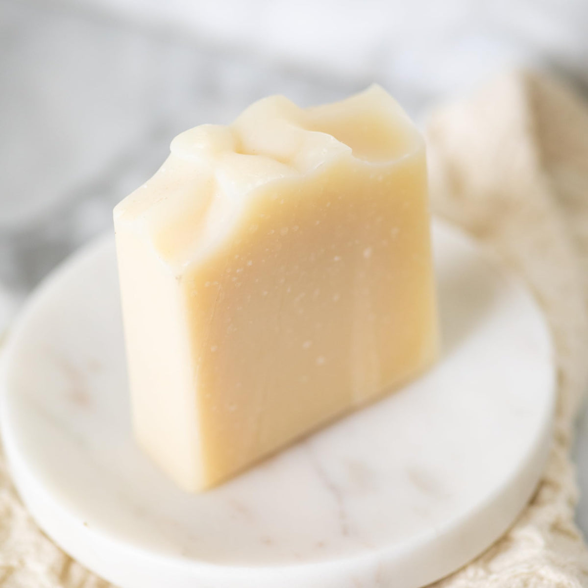 Pretty farm girl close-up texture of soap highlighting creamy tallow lather