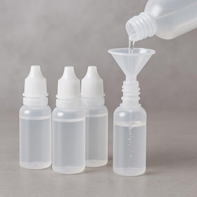 Pretwad front view of four 15ml dropper bottles and funnel, compact travel benefit